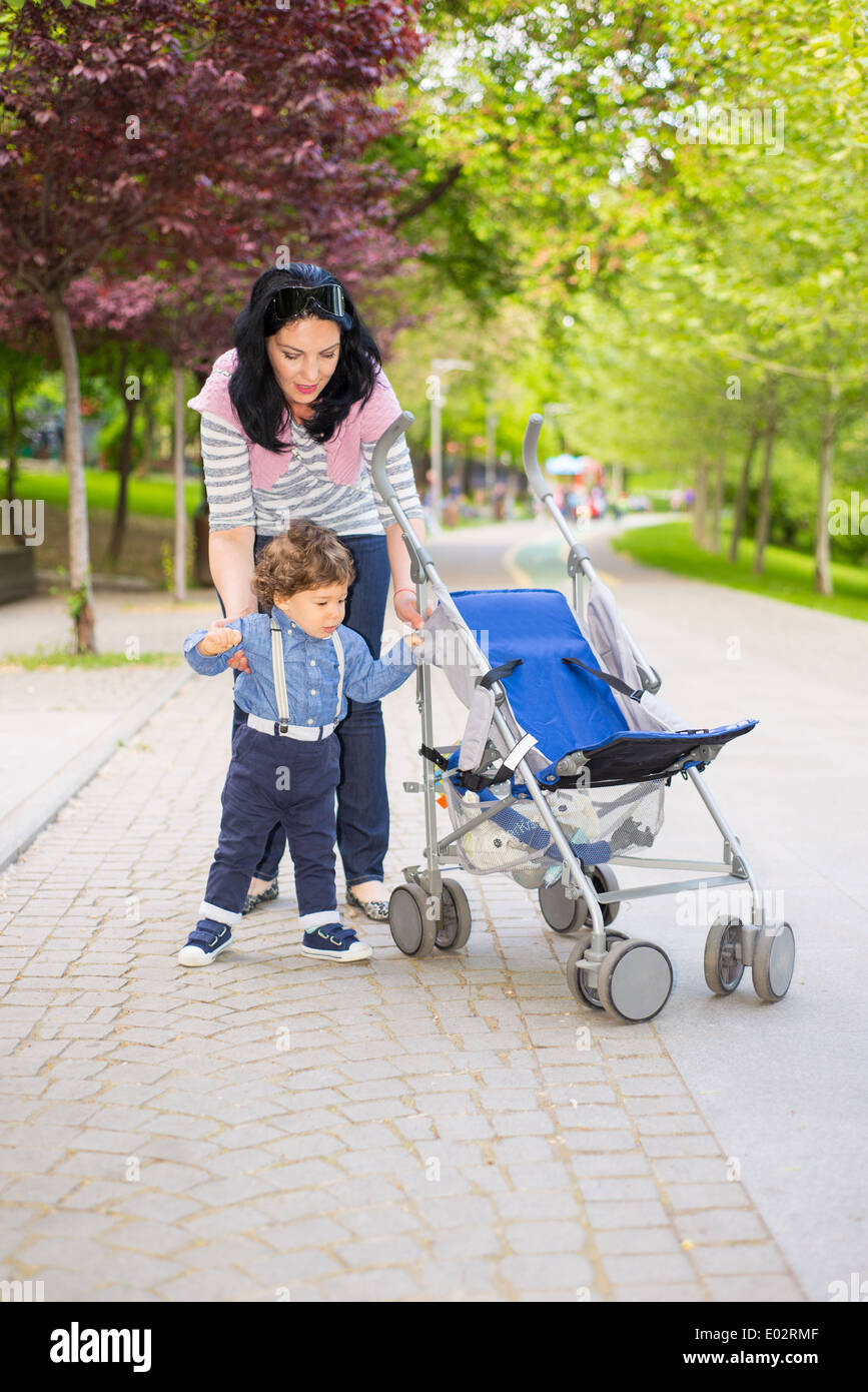 Child helping toddler walk hi-res stock photography and images - Alamy