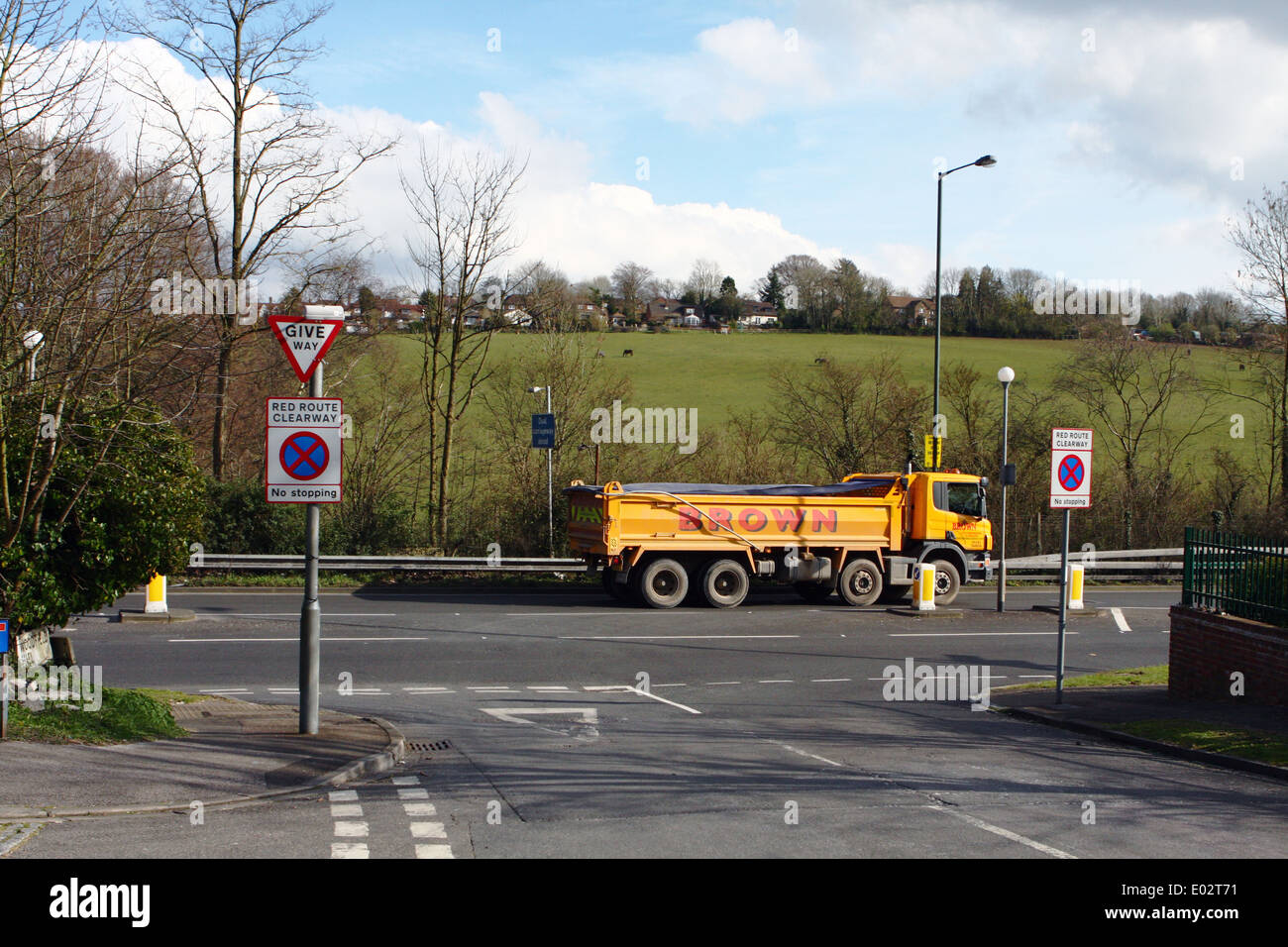 A Brown truck traveling along the A23 road in Coulsdon, Surrey, England