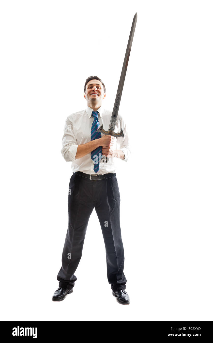 A Young Businessman isolated on a white background holding a steel sword Stock Photo