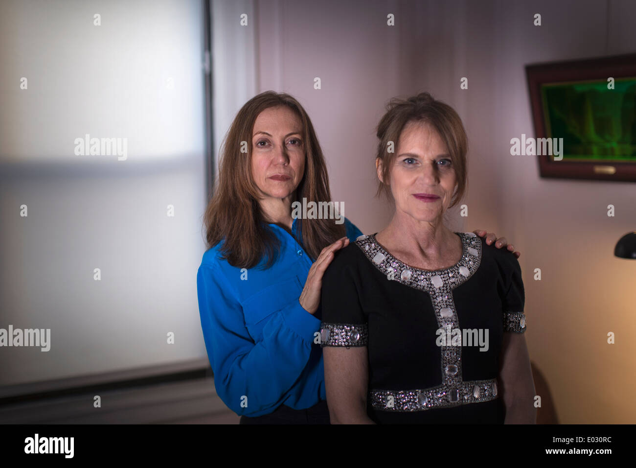 Two women standing one behind the other. Stock Photo