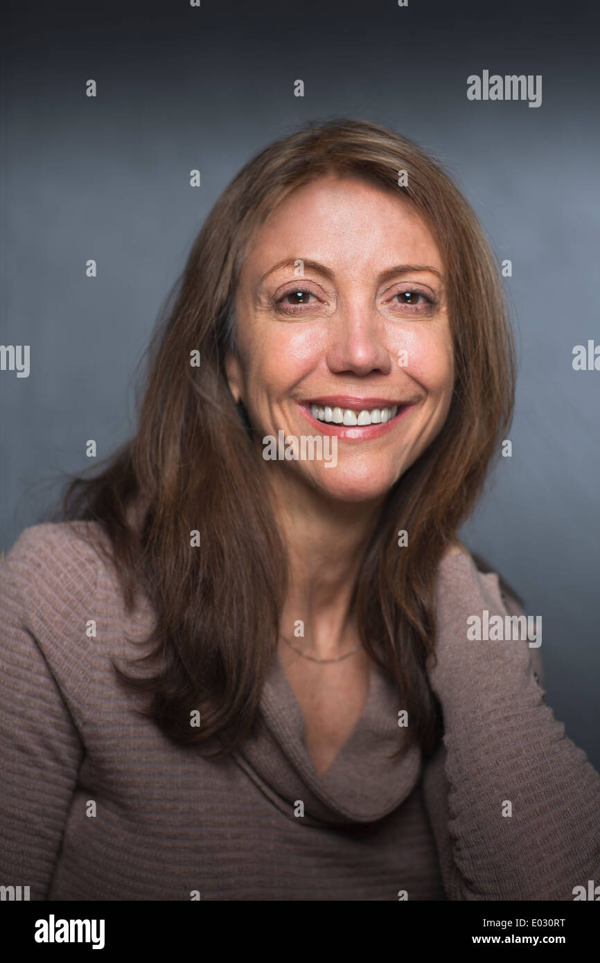 Portrait of a smiling middle aged woman. Stock Photo