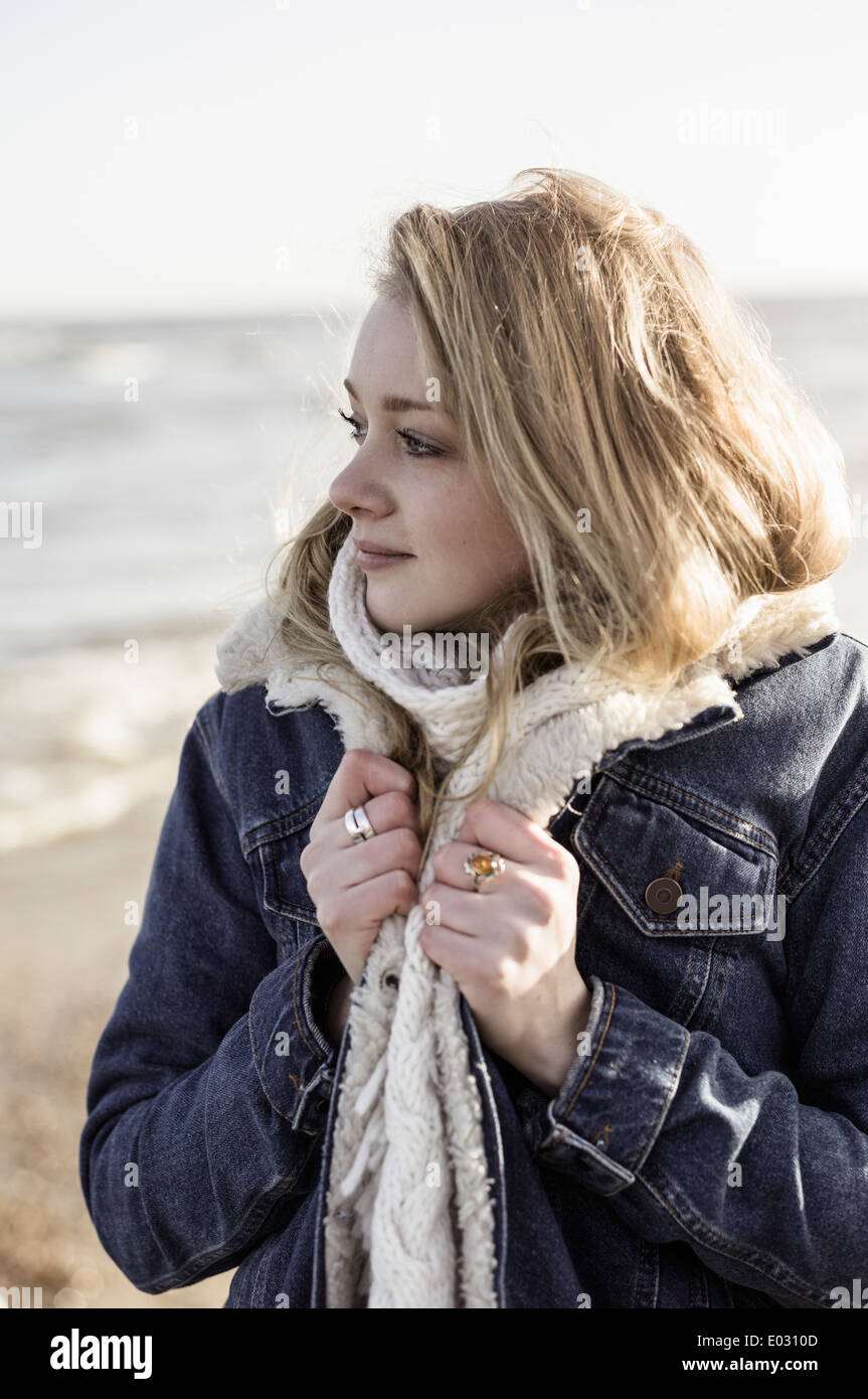 A girl on a beach in winter Stock Photo