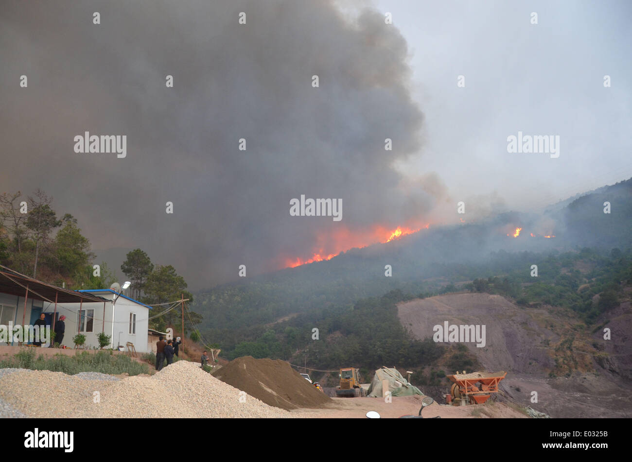 Dali, China. 30th Apr, 2014. Photo taken on April 30, 2014 shows a site where a forest fire occured in Xiaguan Town in the city of Dali in southwest China's Yunnan Province. A forest fire here was extinguished by 8:10 a.m. yet reburned at 2:20 p.m.Wednesday. A total of 1,120 firefighters tackled the blaze, which burned an area of more than 200 mu (about 13.3 hectares). Credit:  Hu Shuli/Xinhua/Alamy Live News Stock Photo