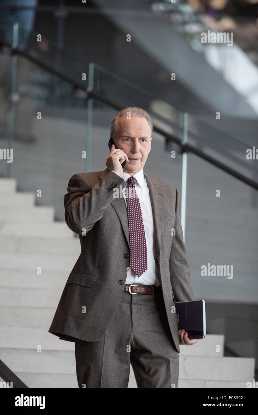 Business on the phone in Harpa, Reykjavik, Iceland Stock Photo