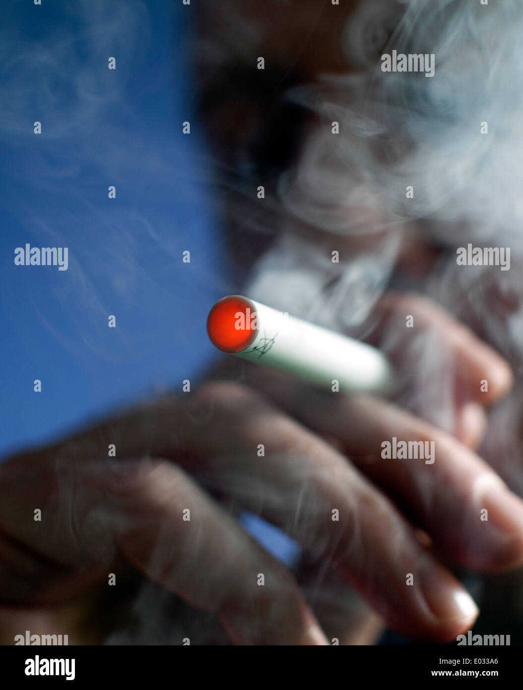 Man smoking a Puritane disposable e-cigarette, London MODEL RELEASED Stock Photo