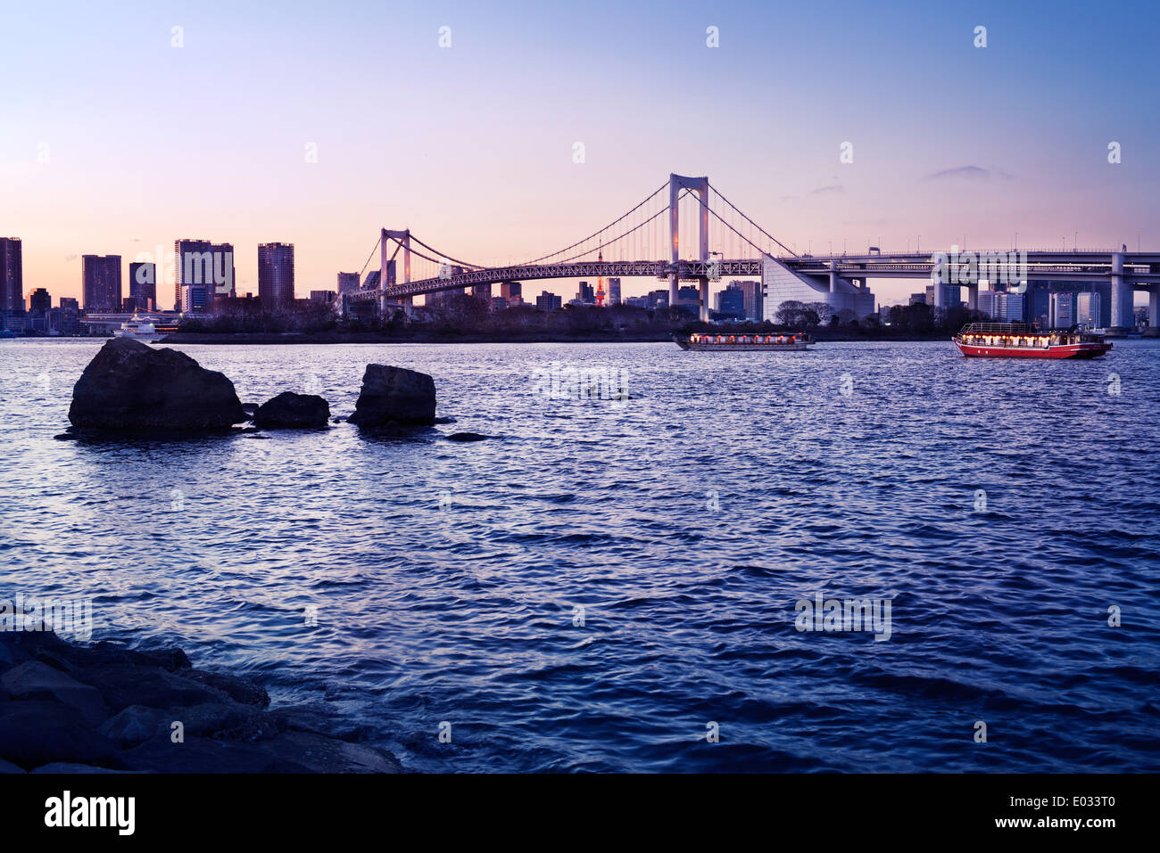 Rainbow bridge across Tokyo Bay in sunset. View from Odaiba, Tokyo, Japan. Stock Photo