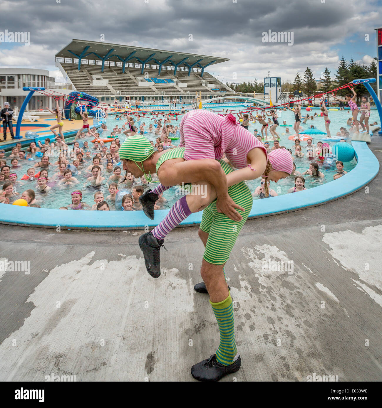 Family fun day at one of the many swimming pools, Reykjavik, Iceland The pools use geothermal energy and are opened all year. Stock Photo