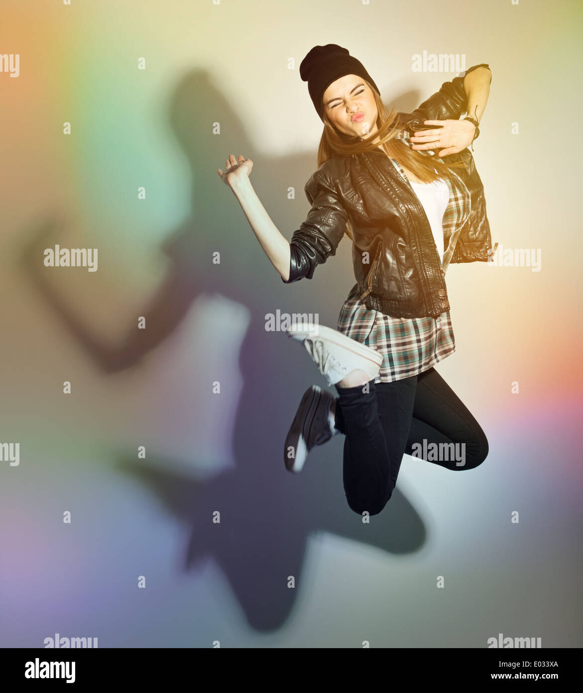 Cute hipster teenage girl jumping Stock Photo