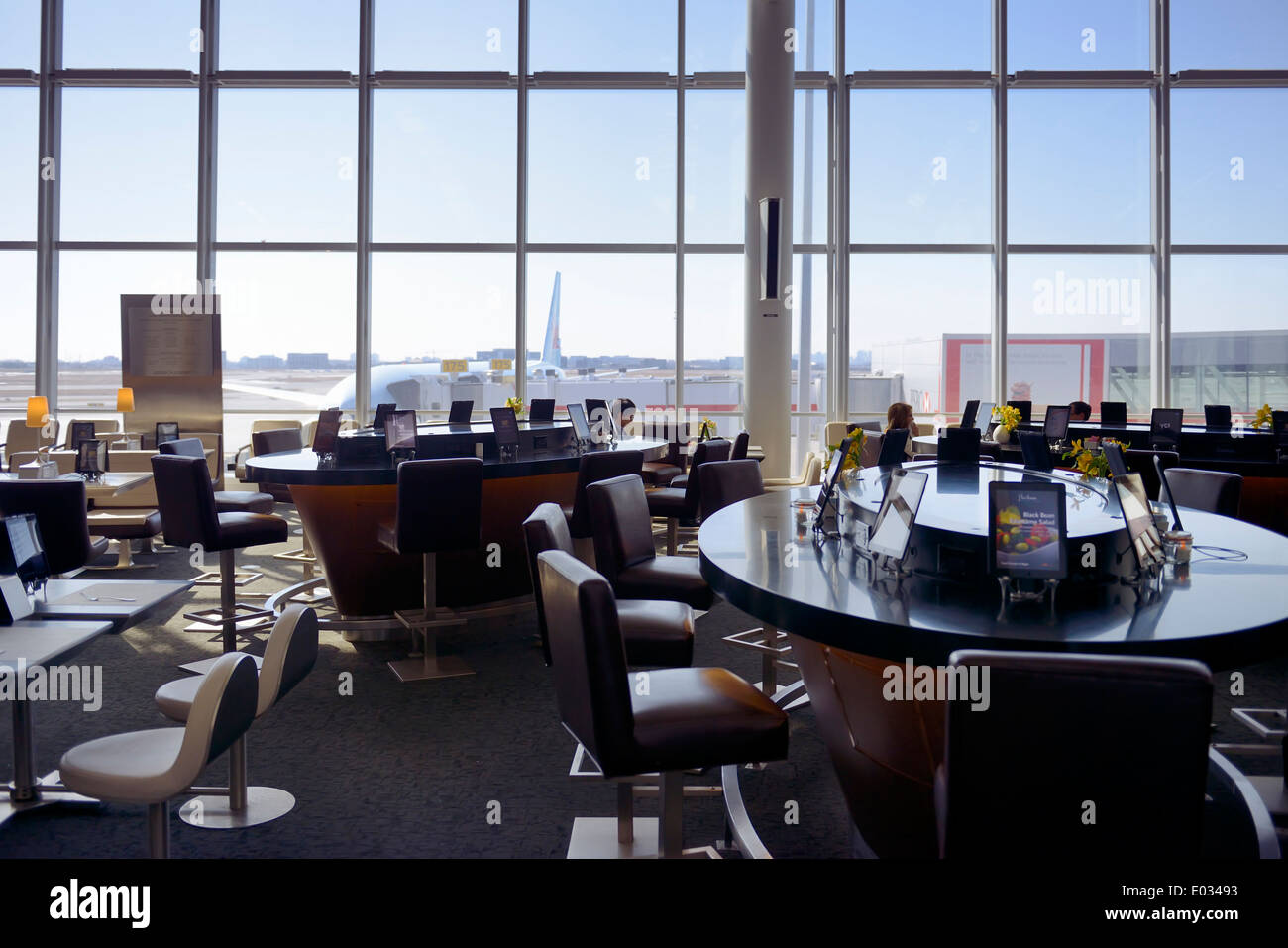 Airport restaurant tables equipped with Apple iPad tablets. Toronto Pearson International Airport. Stock Photo