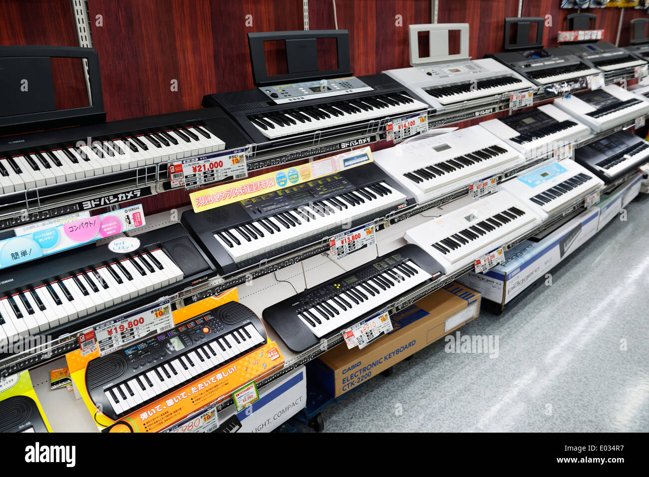 Synthesizers, electronic keyboards on music instrument store display in Tokyo, Japan Stock Photo