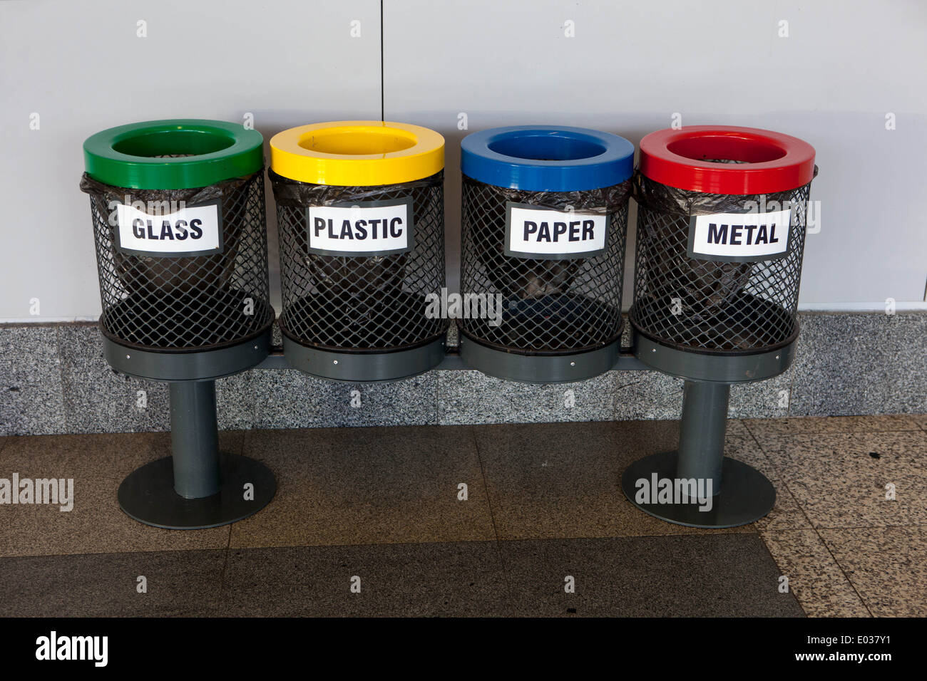 Waste recycling bin with multiple sections for different materials Stock Photo