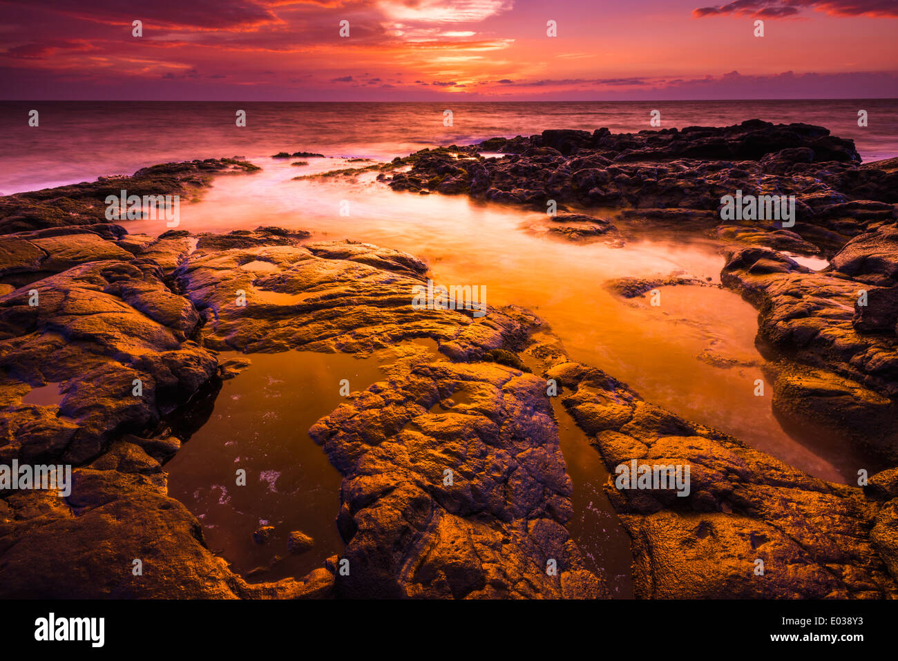 Sunset and tide pool above the Pacific, KailuaKona, Hawaii USA Stock
