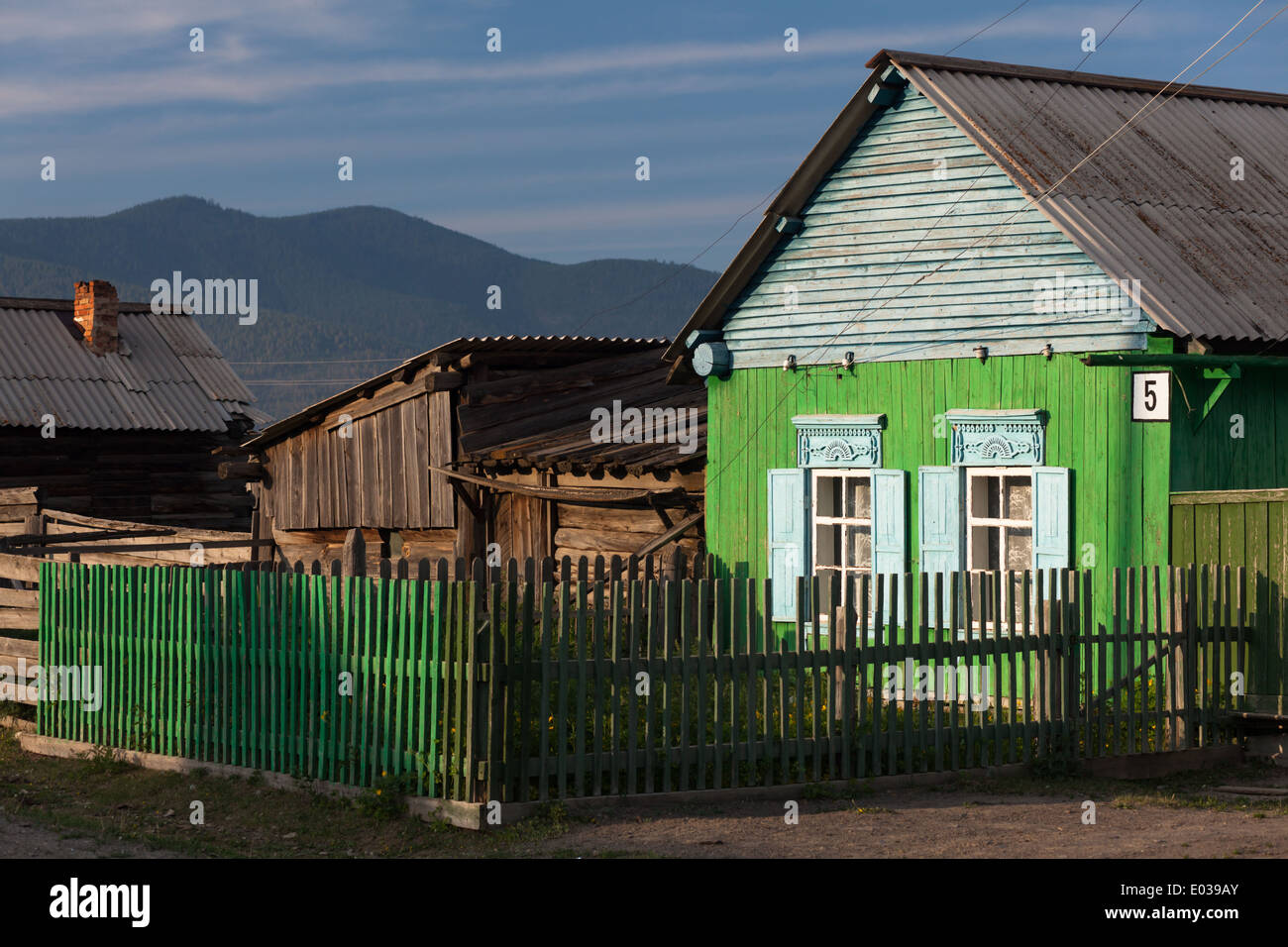 Wooden house with traditional shutters in Bolshoe Goloustnoe on the shore of Lake Baikal, Siberia, Russia Stock Photo