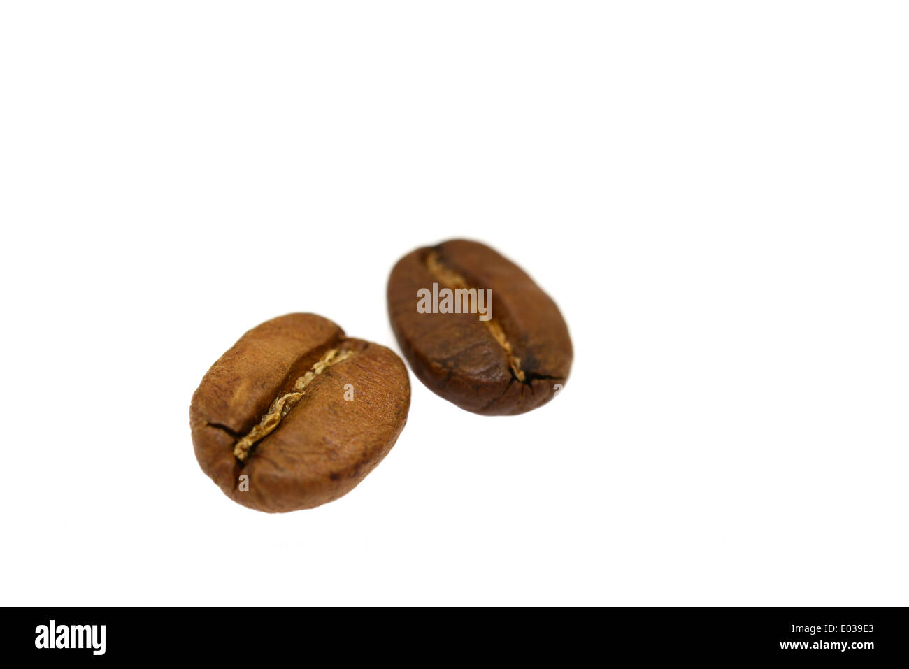 Brown coffee beans isolated on white background Stock Photo - Alamy