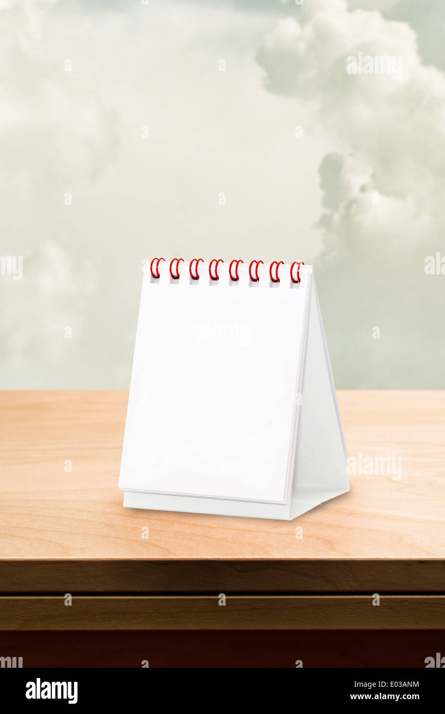 Blank desk calendar at wooden table, copy space for your design Stock