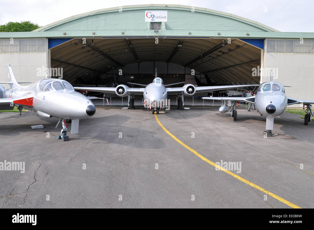 Cotswold Airport. Canberra and Hunter classic vintage jets of Midair Squadron civilian jet display team. Ex RAF aircraft. C2 Aviation hangar Stock Photo