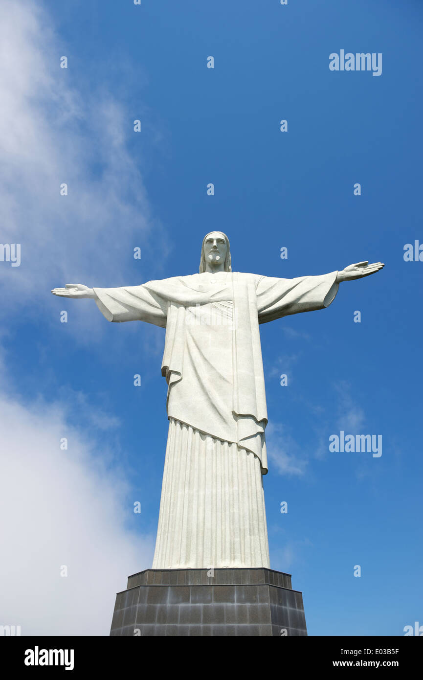 Corcovado Christ the Redeemer standing full length bright sky clouds in Rio de Janeiro Brazil Stock Photo
