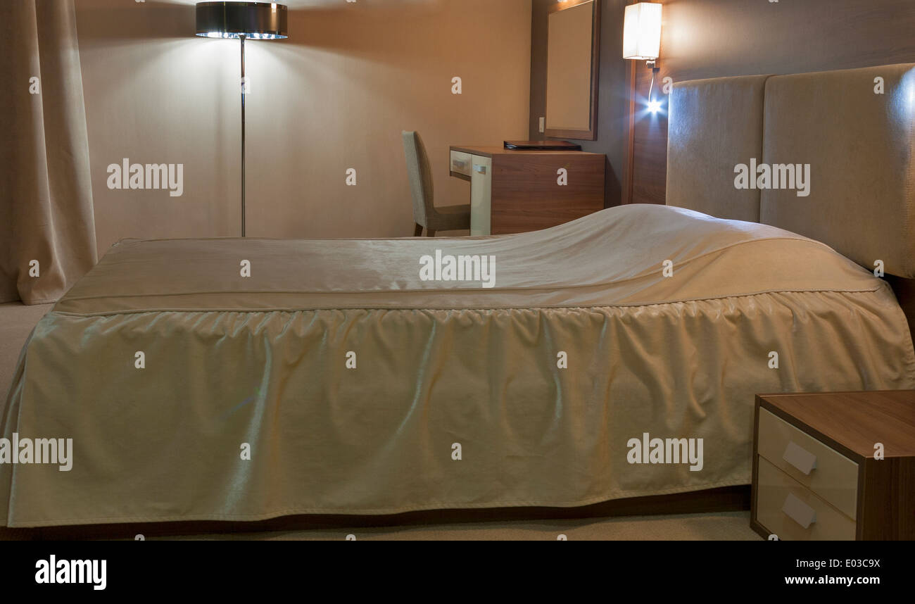 sleeping room with double bed illuminated Stock Photo