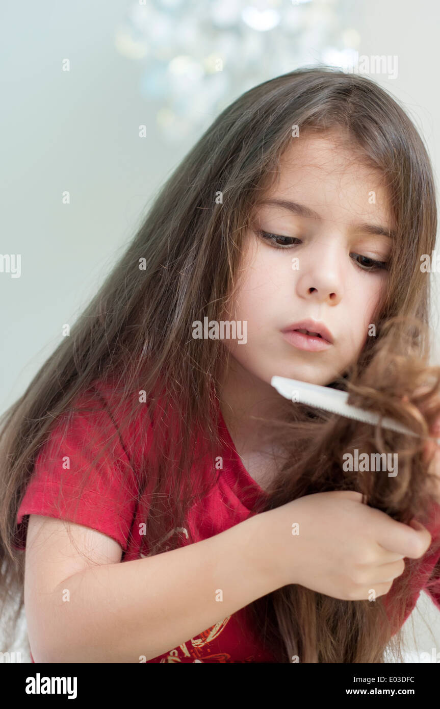 Girl brushing hair Stock Photo