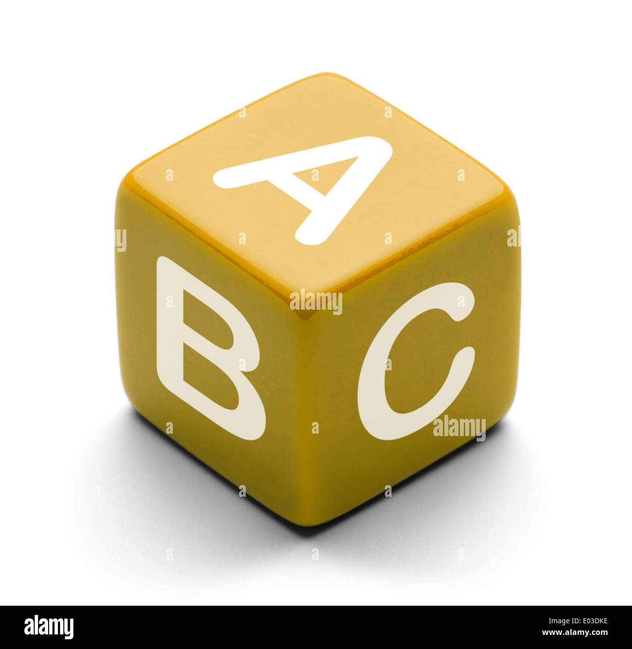 Yellow Dice With letters A B and C on it Isolated on White Background. Stock Photo