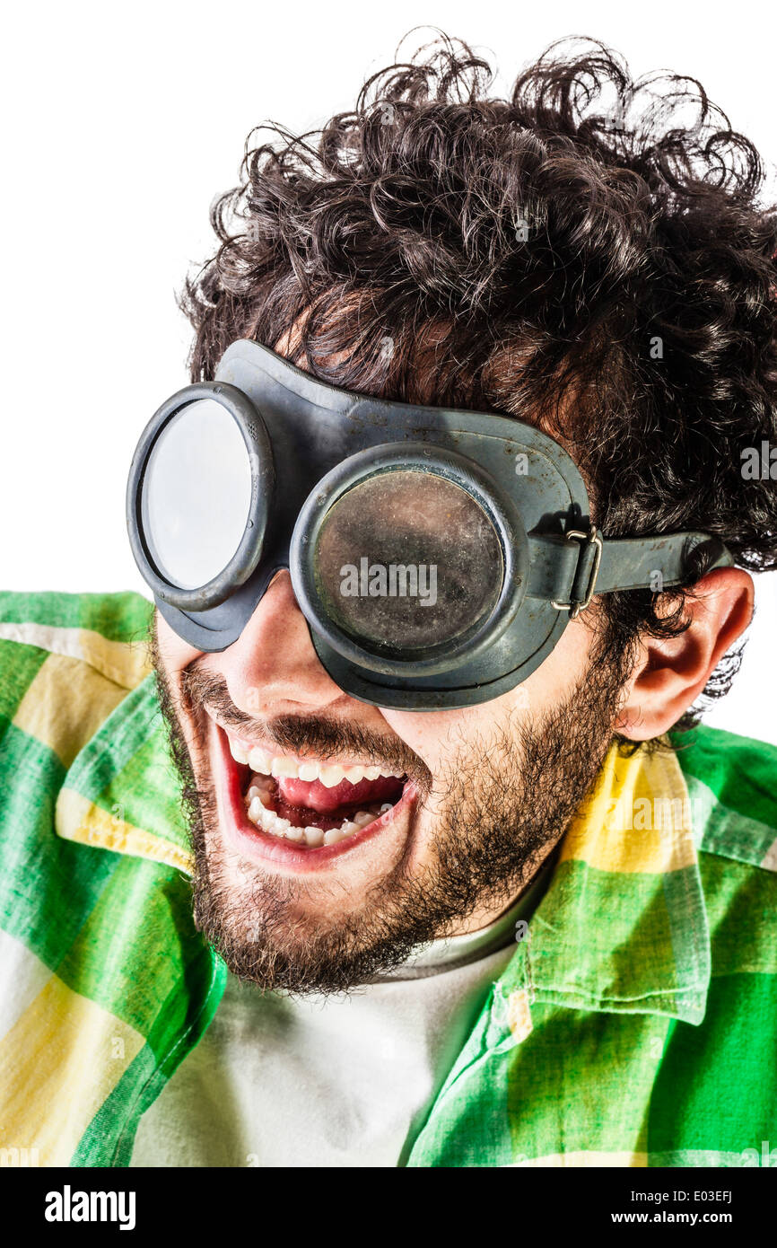 a guy wearing casual clothes and on old pair of goggles over a white background Stock Photo