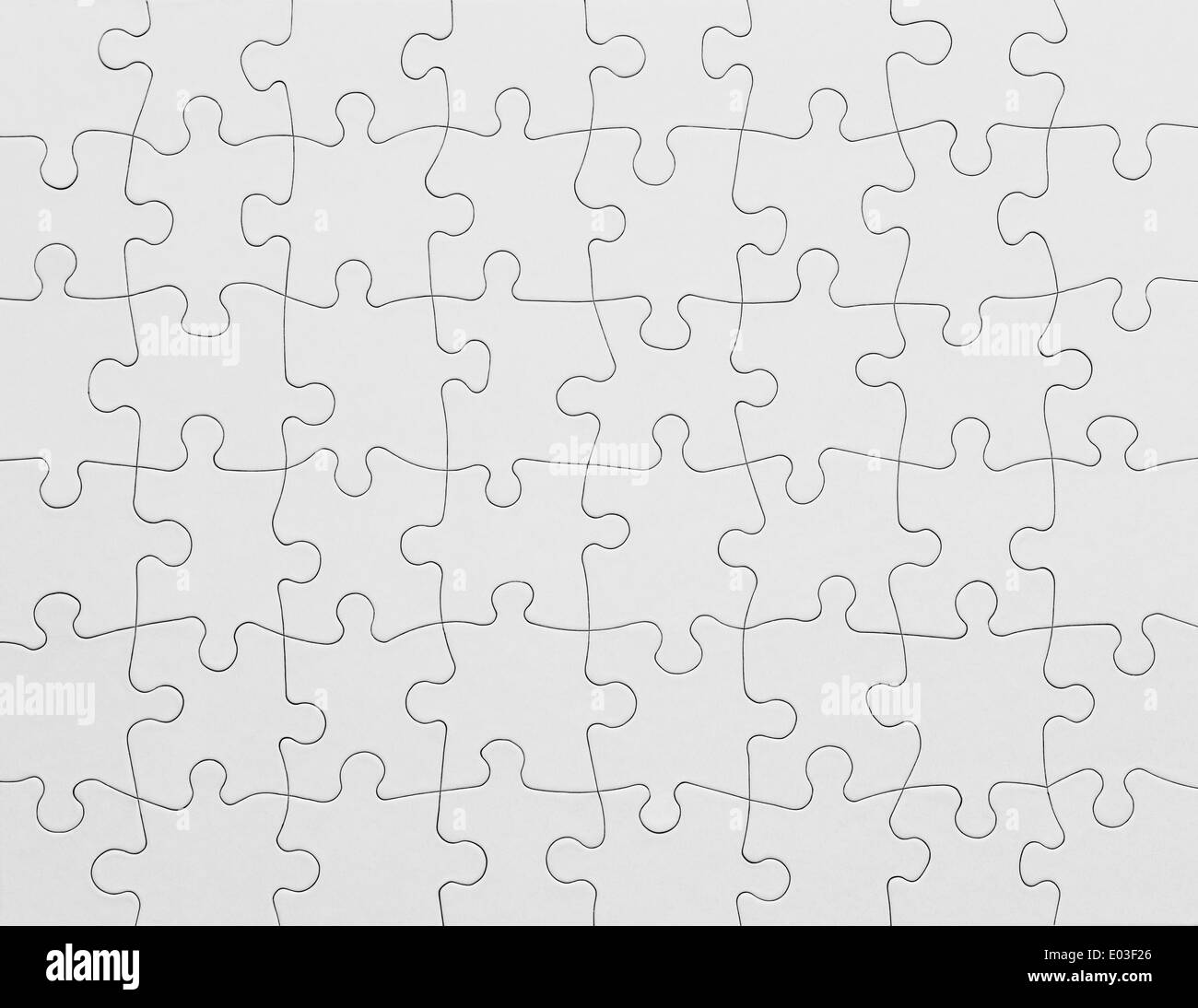 Complete White Puzzle with Copy Space. Stock Photo