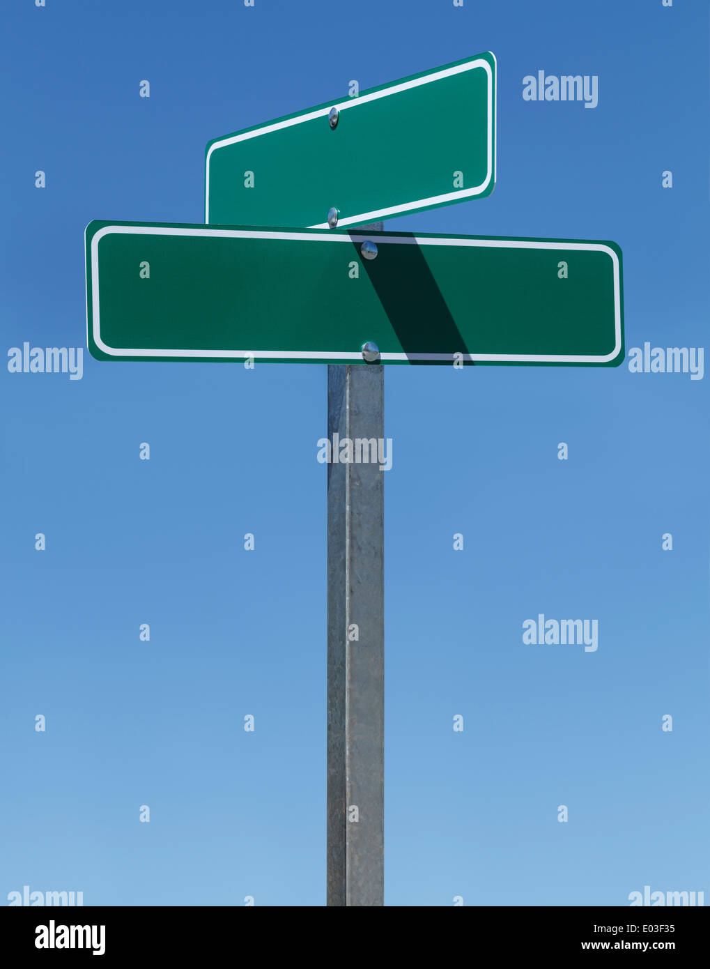 Two Green Street Signs on Metal Pole With Copy Space with Blue Sky. Stock Photo