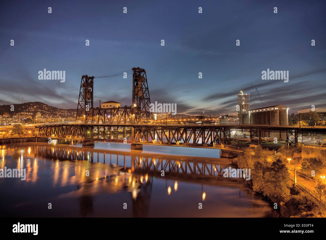 Steel Bridge with Broadway and Fremont Bridges Over Willamette River at Evening Blue Hour in Portland Oregon Stock Photo