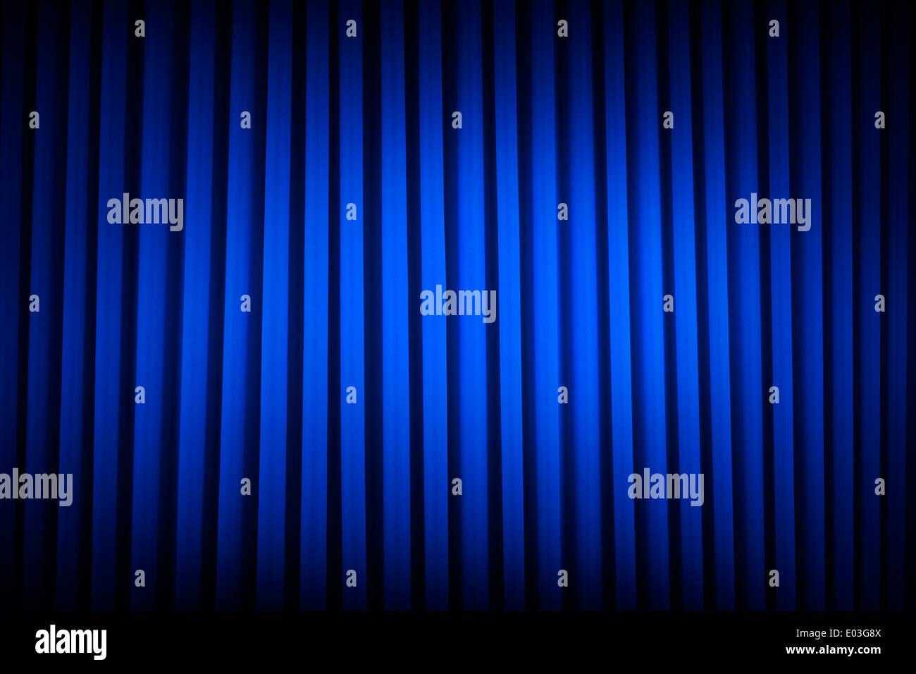 Blue Velvet Movie Curtains Dim Lit Backgrounds. Stock Photo