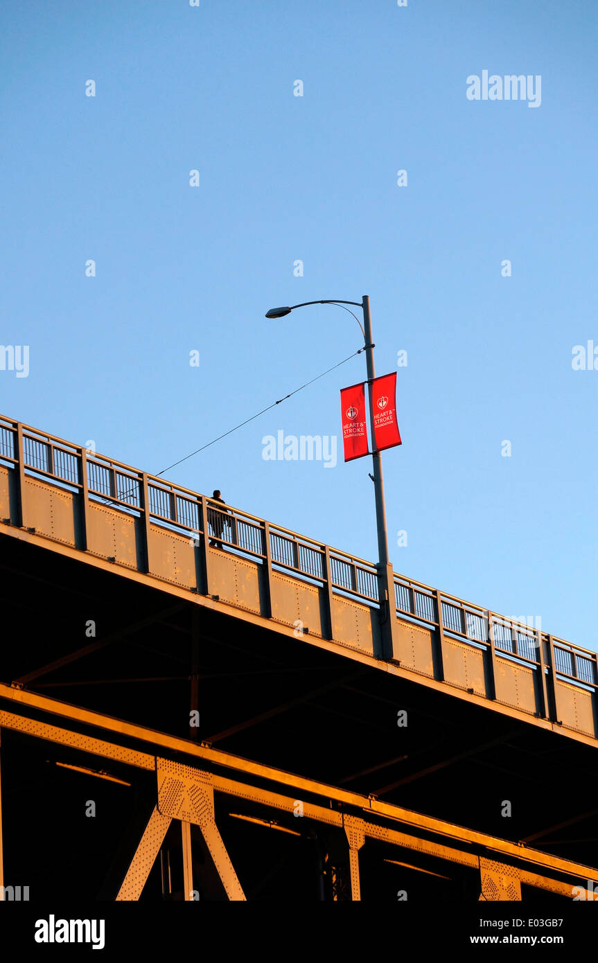Man walking across the Granville Bridge, Vancouver, BC, Canada Stock Photo