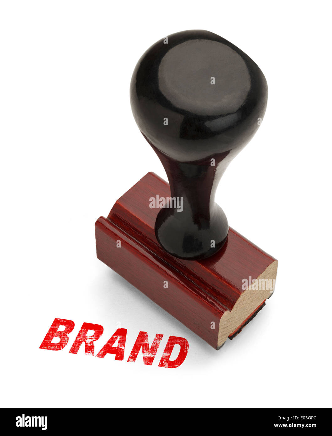 Brand Stamp in Red Ink With Wooden Handle Rubber Stamper Isolated on White Background. Stock Photo