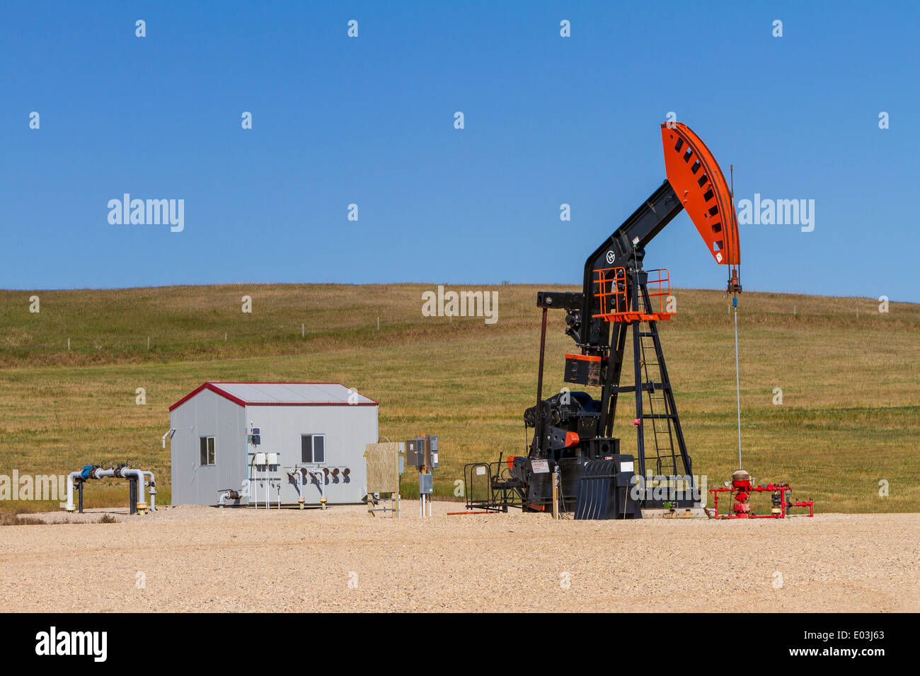 An oil production pump jack in the Bakken play oil field deposits near