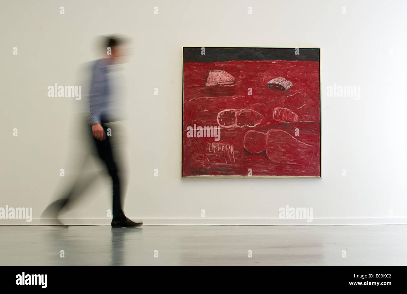 Berlin, Germany. 30th Apr, 2014. A visitor walks past the painting 'The Light' (1975) by US artist Philip Guston in the art gallery Aurel Scheibler in Berlin, Germany, 30 April 2014. Many of Berlin's galleries participate in the event 'Gallery Weekend from 02 to 04 May. Photo: DANIEL NAUPOLD/dpa/Alamy Live News Stock Photo