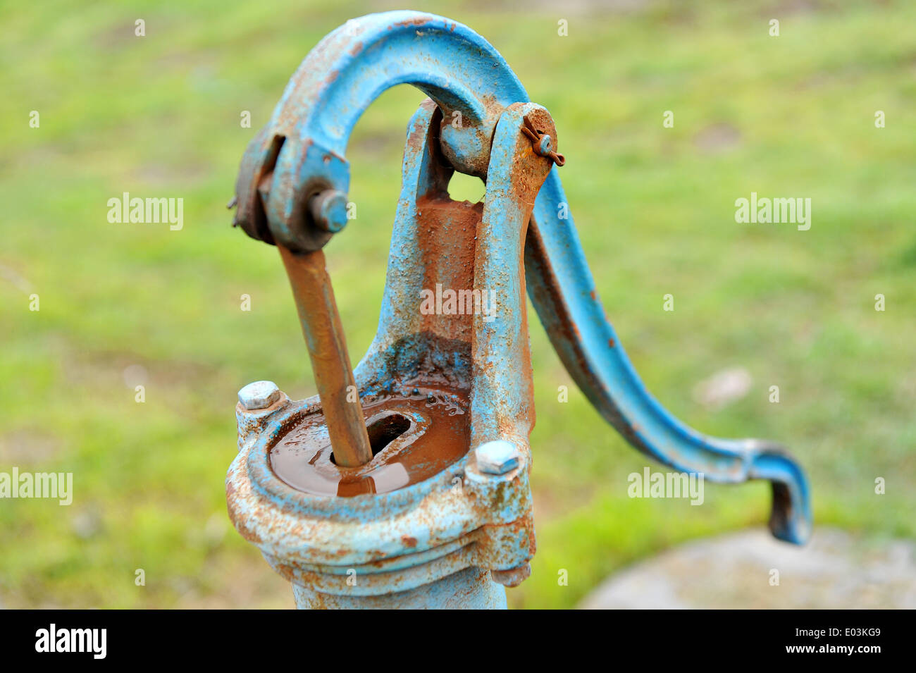 Old and rusty manual water pump Stock Photo