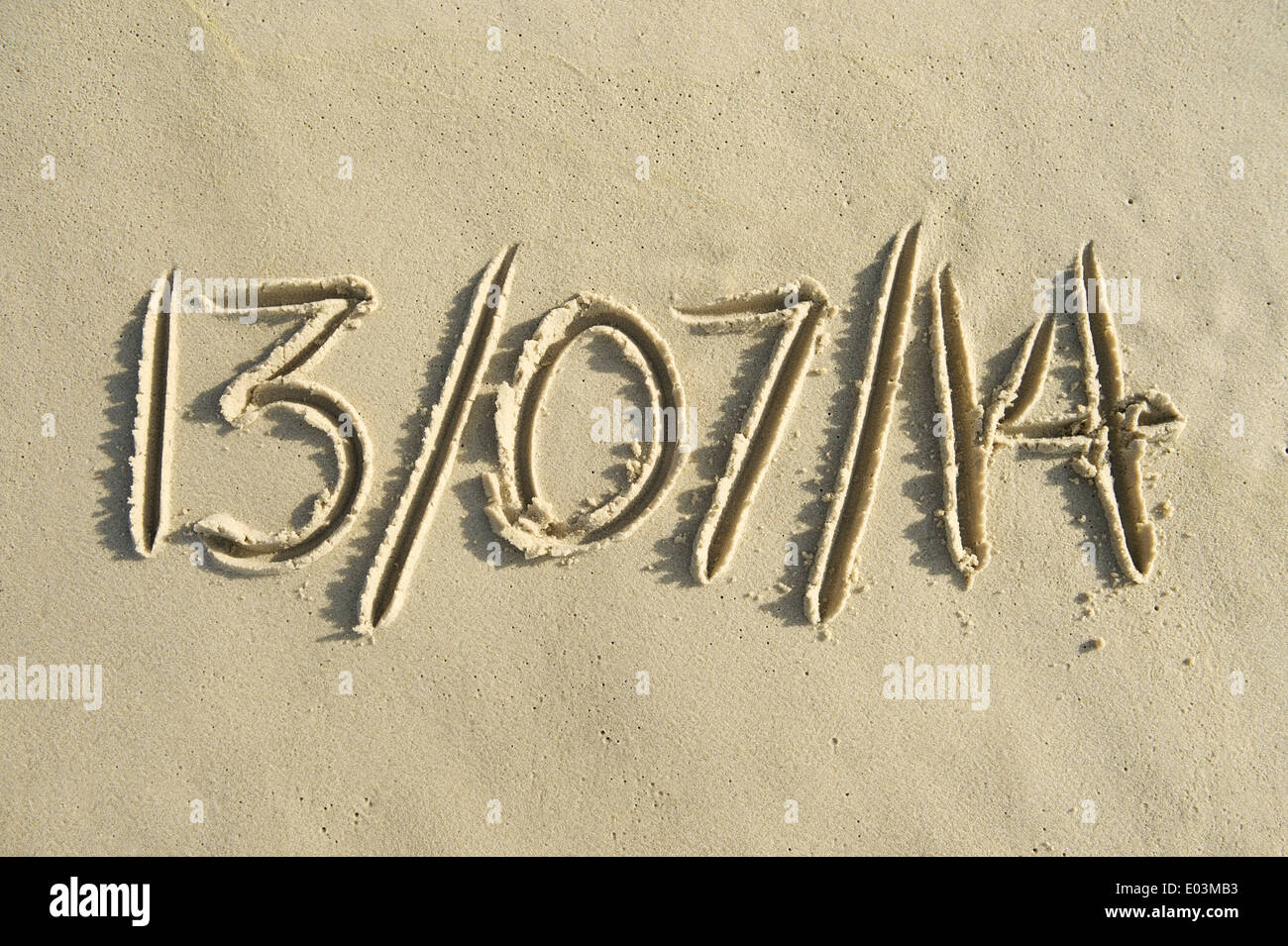 World Cup Brazil final date message handwritten in sand Stock Photo