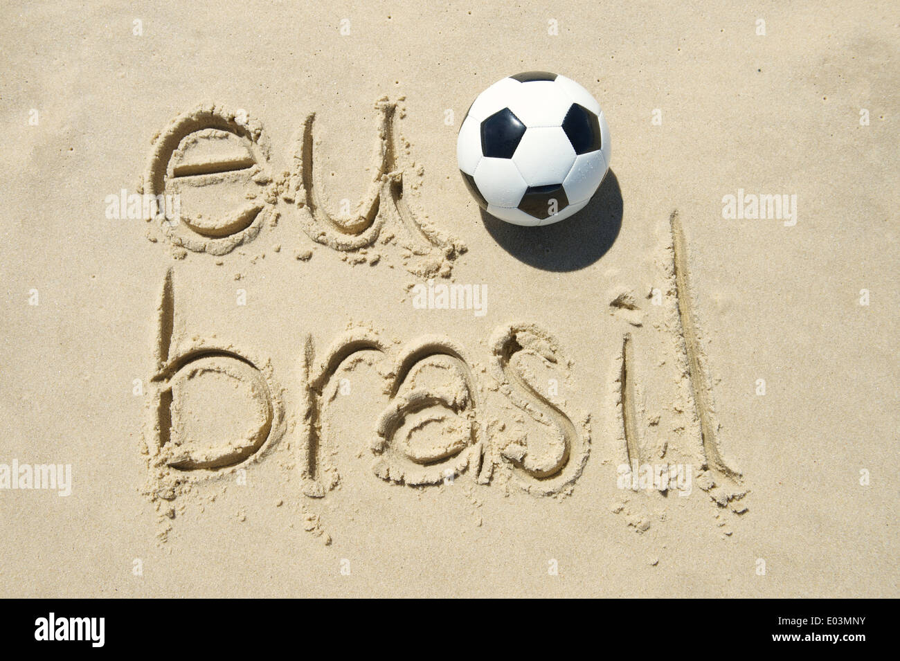 Eu futebol I love Brasil message with a football handwritten in sand Stock Photo