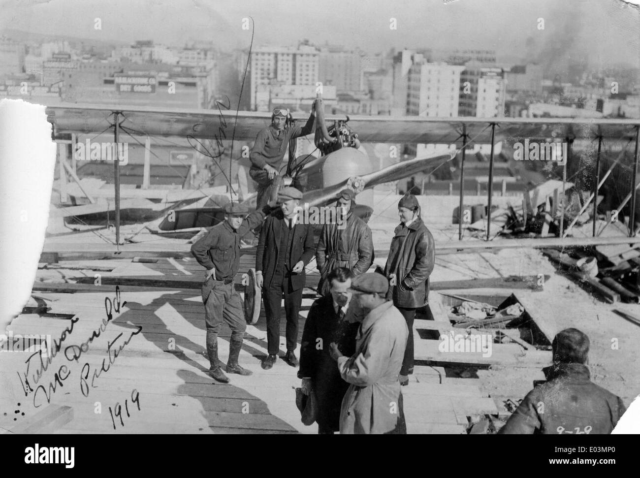 Clark, Hester, Mark Campbell, Wally Timm and others with airplane on