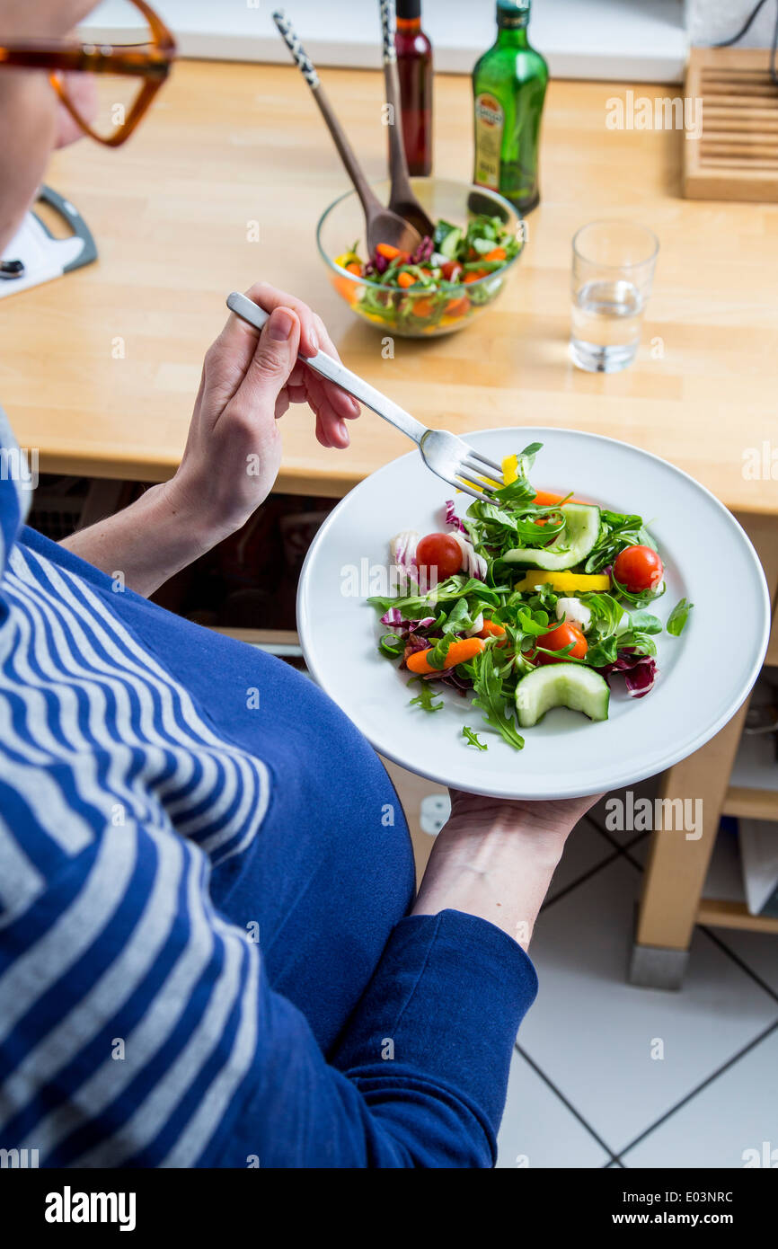 Pregnant woman prepares to healthy food, a healthy meal Stock ... Pregnant woman prepares to healthy food, a healthy meal Stock ...