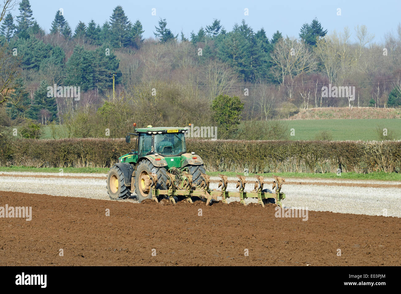 Tractor and plough, Suffolk, UK. Stock Photo