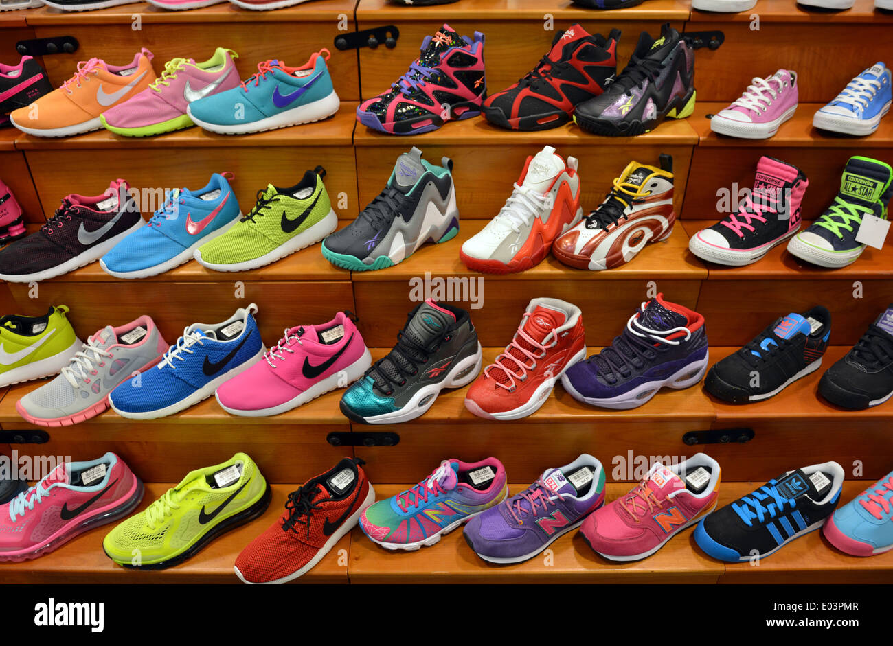 Colorful men's athletic shoes for sale at a sporting goods store at Roosevelt  Field in Long Island Stock Photo - Alamy