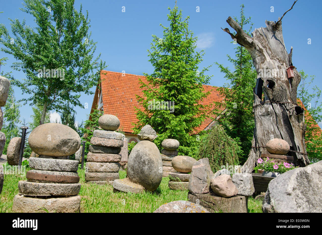 stone composition in old village in the summer park Stock Photo