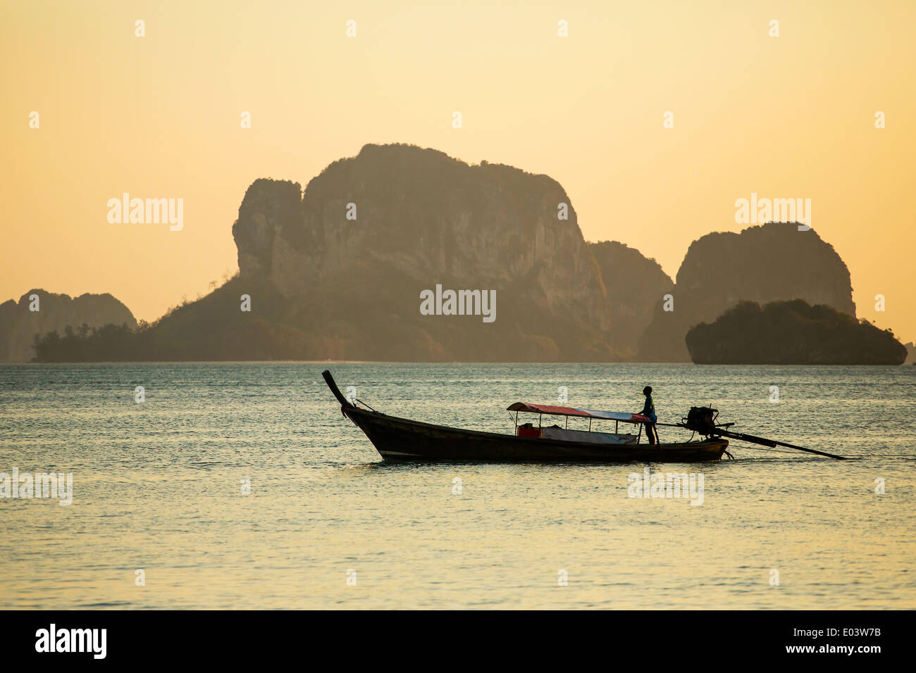 Longtail boat in the sea at the sunset Stock Photo