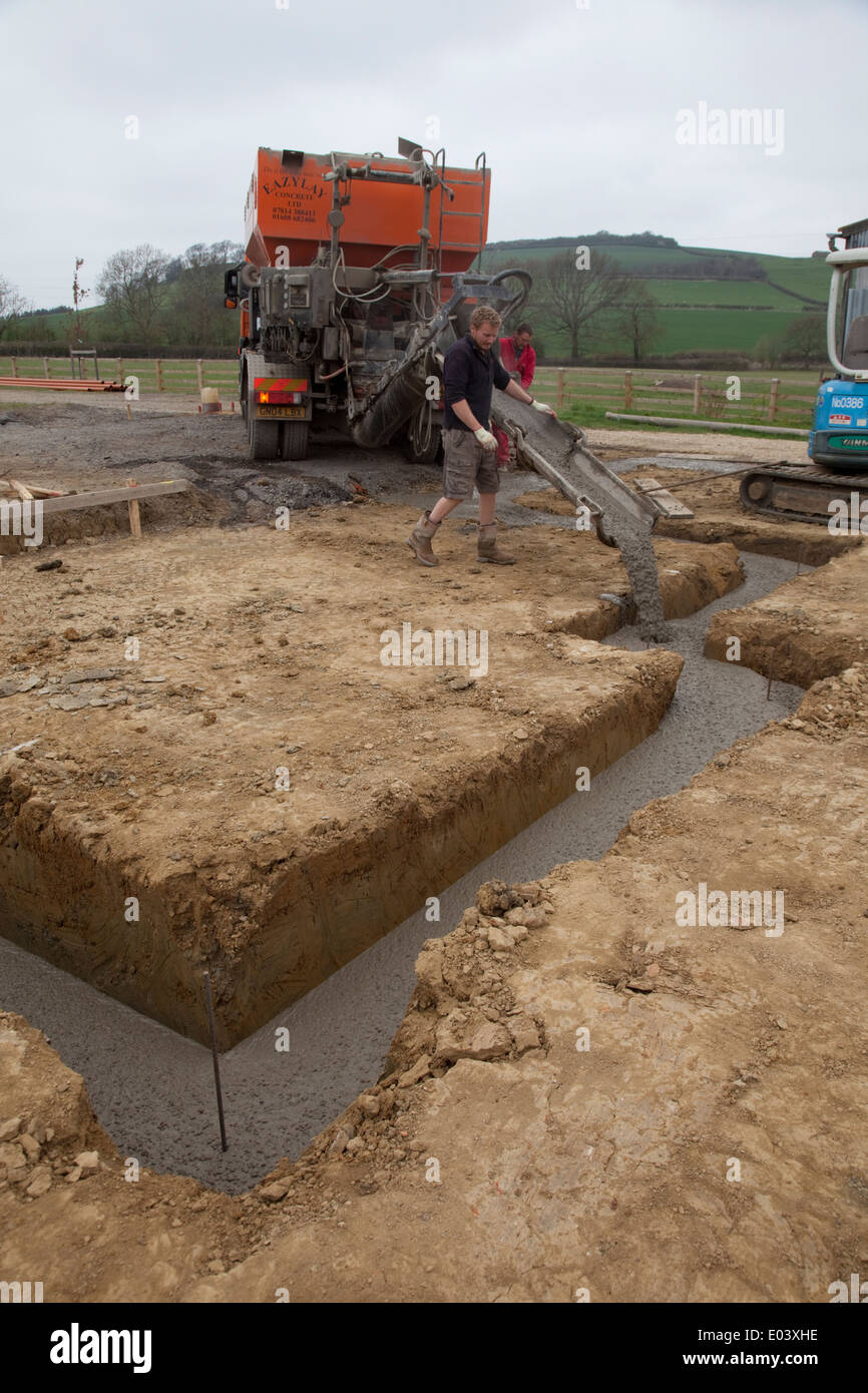 EasyLay concrete lorry pouring concrete into newly dug footings Colemans Hill Farm Mickleton UK Stock Photo