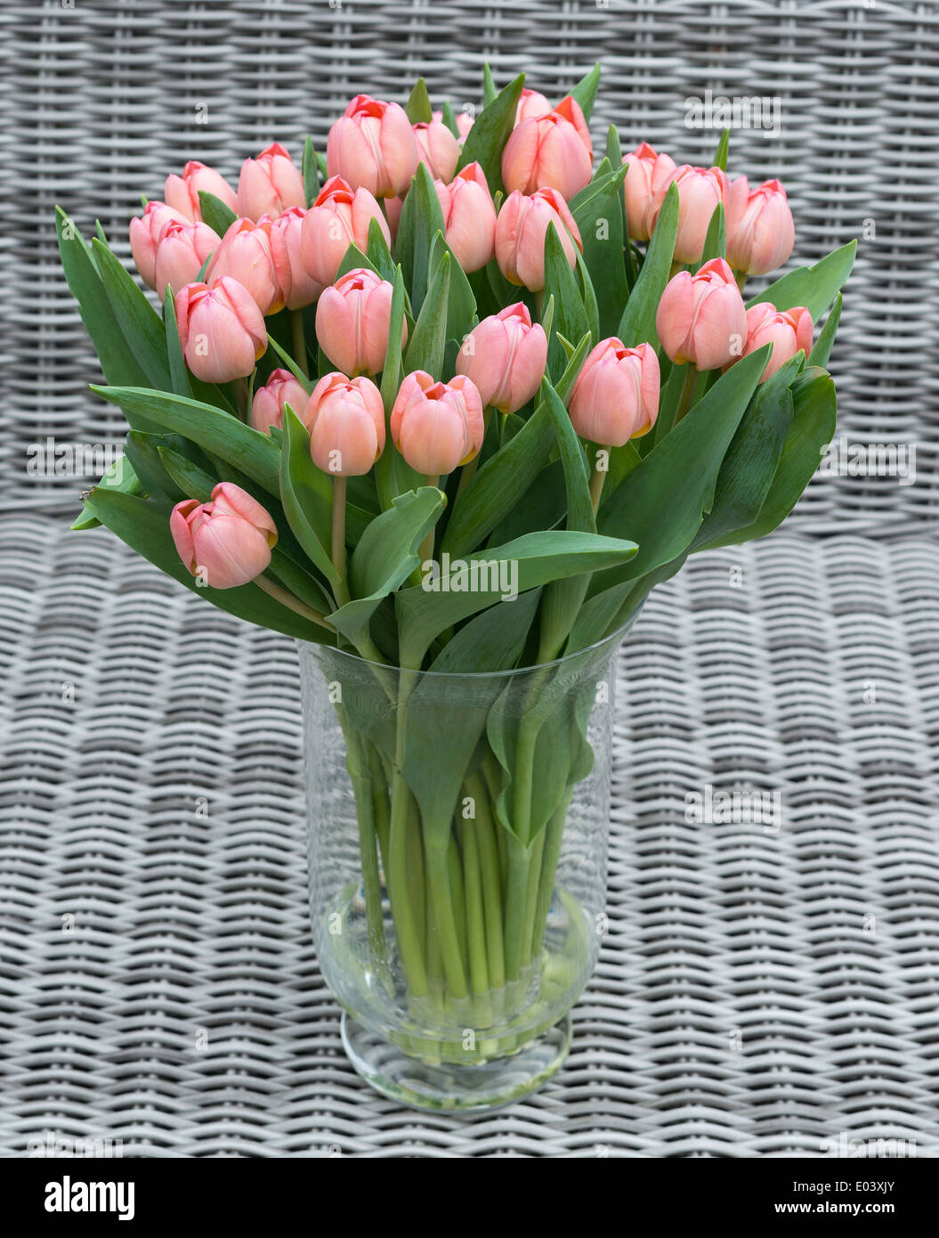 vase with pink tulip flowers for mothers day on bamboo background Stock Photo Alamy