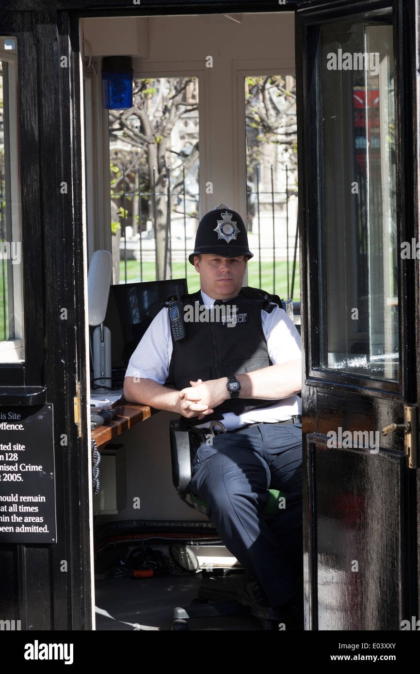 Police officer in hut at entrance to Houses of Parliament London. Stock Photo