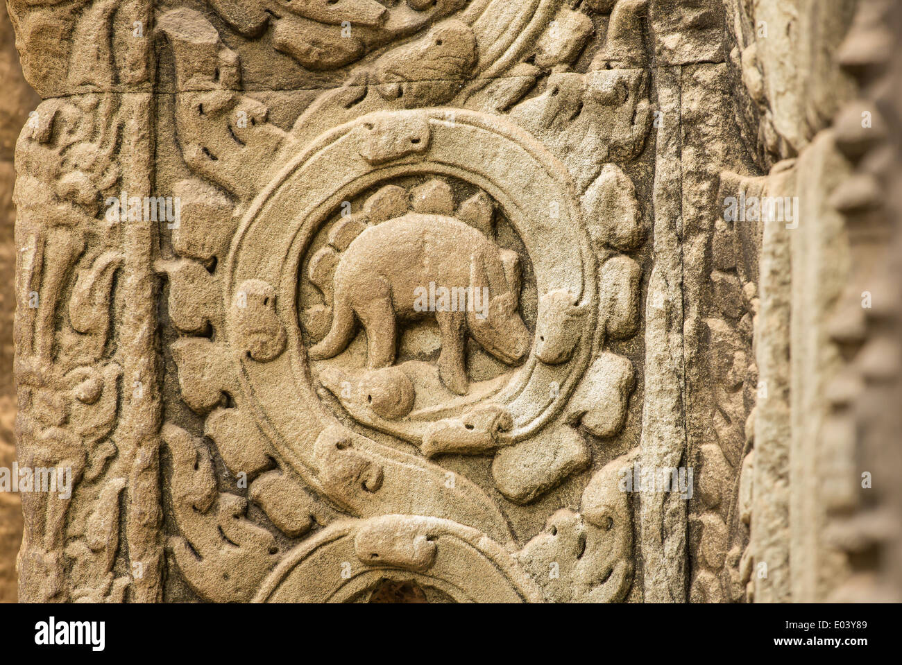 Stegosaurus bas-relief on the wall of Ta Prohm temple at Angkor Wat complex, Siem Reap, Cambodia Stock Photo