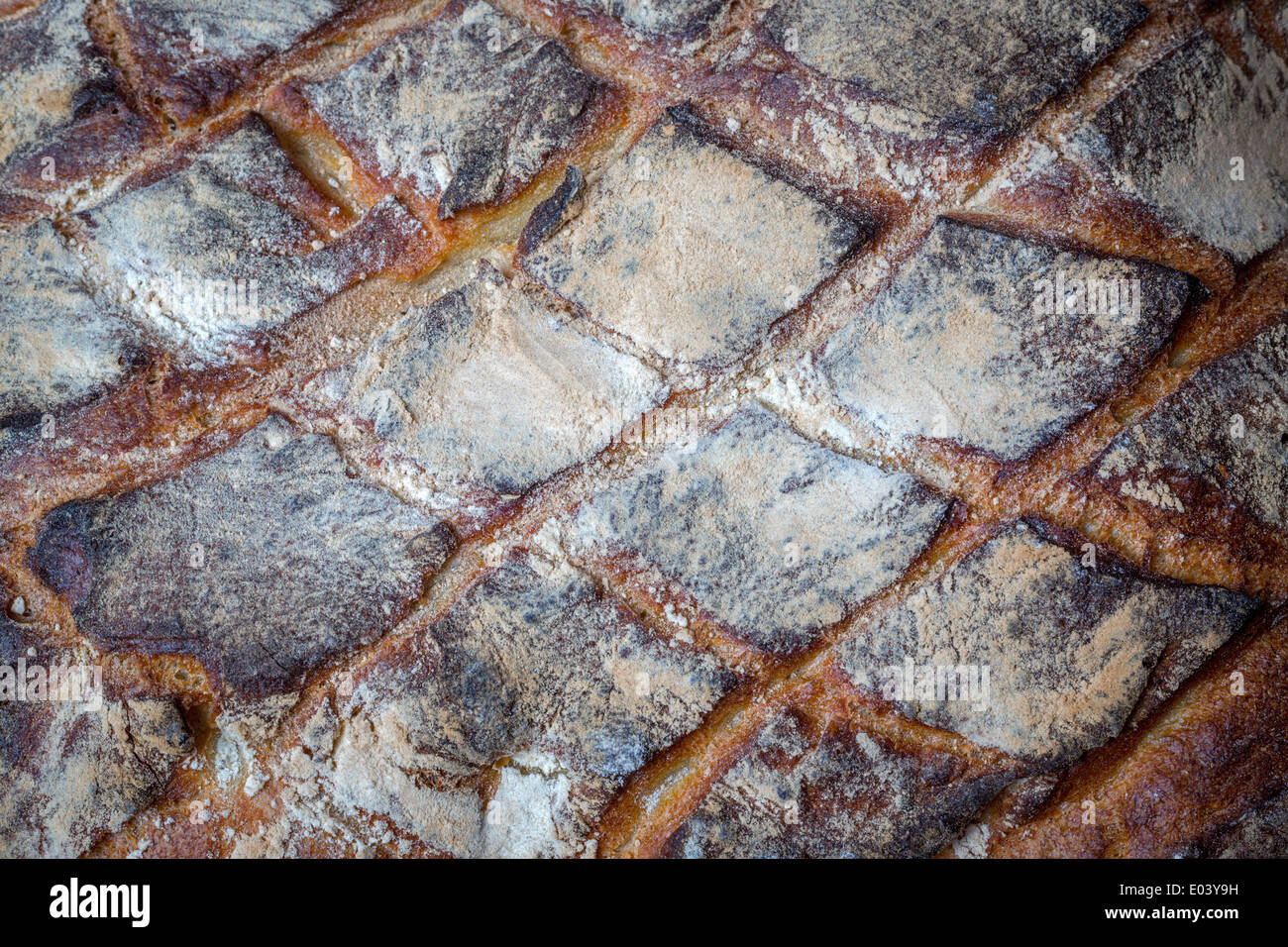 Details of the crust of a farmhouse loaf (France). Détail de la croûte d'un pain de campagne (France). Stock Photo