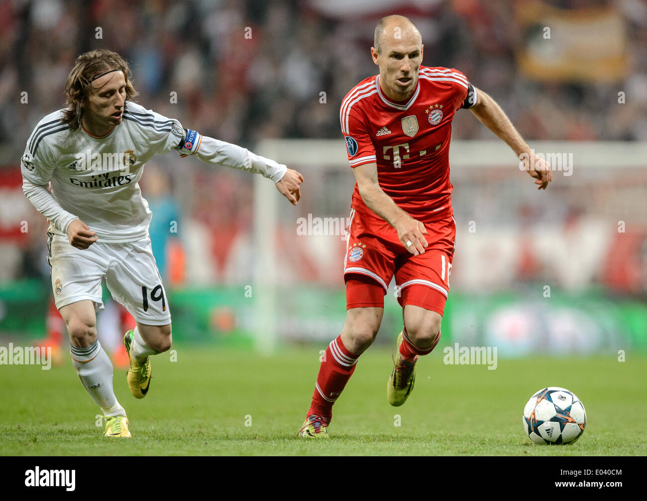 Munich, Germany. 29th Apr, 2014. Madrid's Fabio Coentrao (L) in action against Munich's Luka Modric during the Champions League semifinal second leg match between Bayern Munich and Real Madrid at Allianz Arena in Munich, Germany, 29 April 2014. Photo: Thomas Eisenhuth/dpa - NO WIRE SERVICE/dpa/Alamy Live News Stock Photo