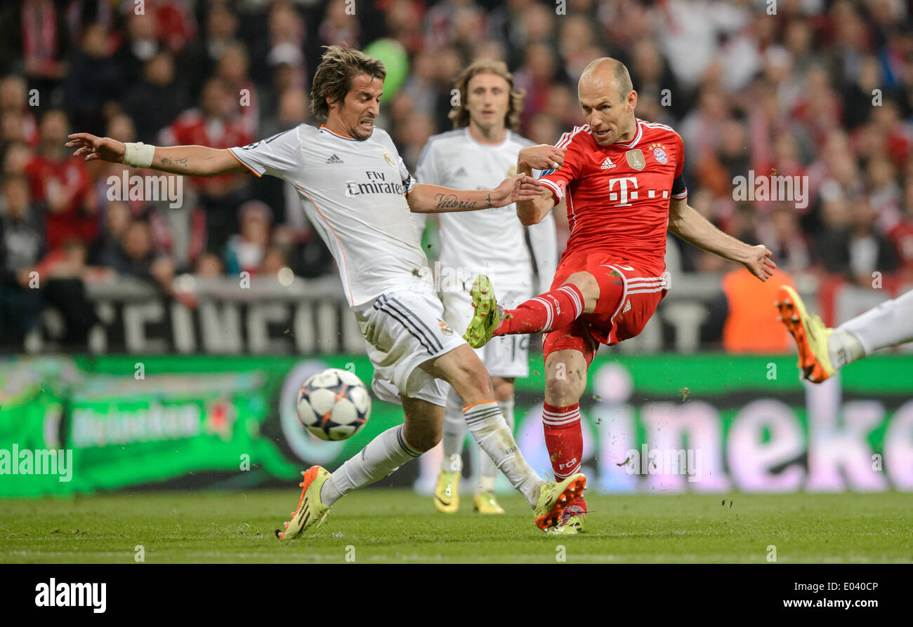 Munich, Germany. 29th Apr, 2014. Madrid's Fabio Coentrao (L) in action against Munich's Thomas Mueller during the Champions League semifinal second leg match between Bayern Munich and Real Madrid at Allianz Arena in Munich, Germany, 29 April 2014. Photo: Thomas Eisenhuth/dpa - NO WIRE SERVICE/dpa/Alamy Live News Stock Photo