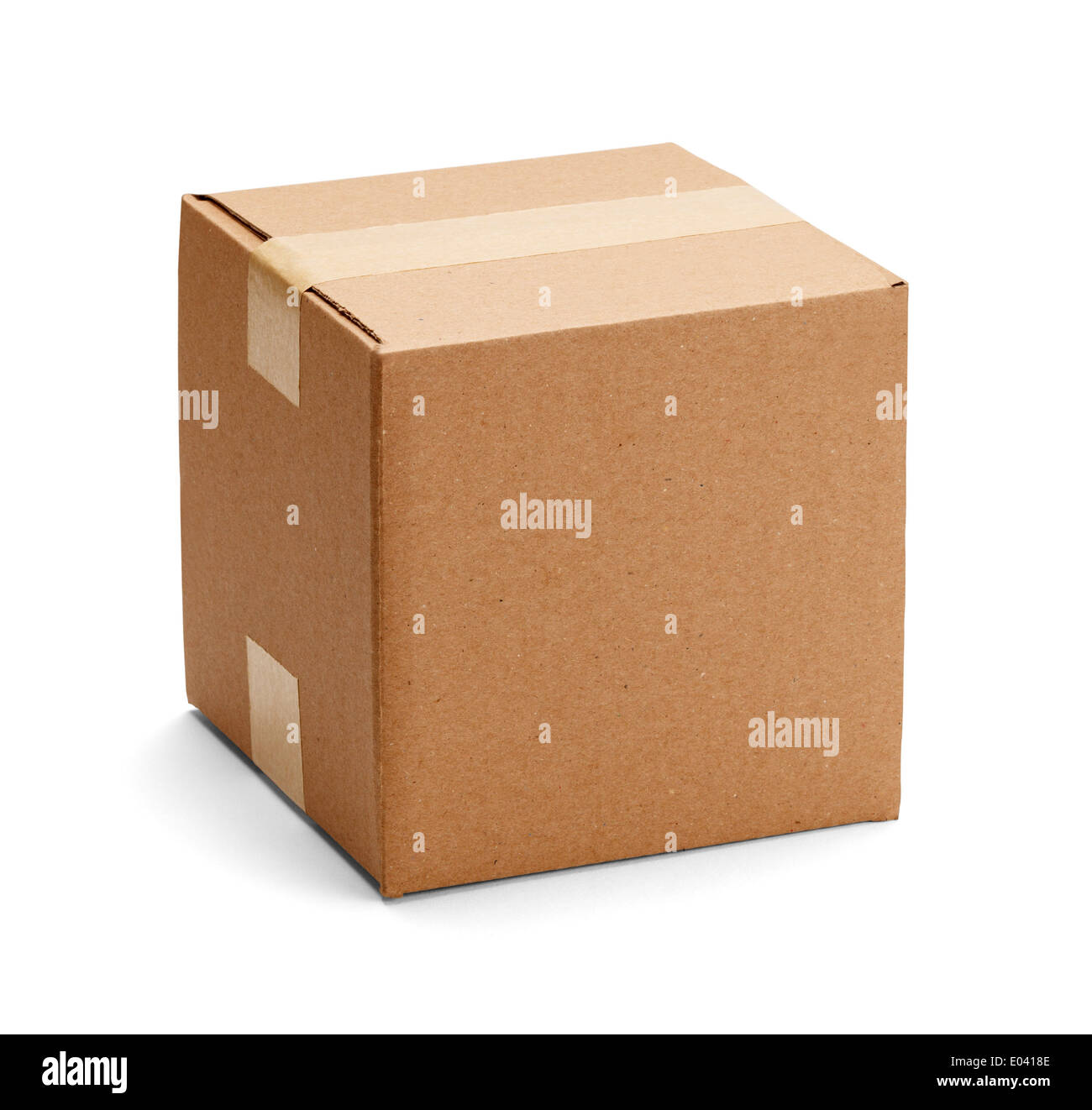 Closed cardboard box taped up and isolated on a white background. Stock Photo